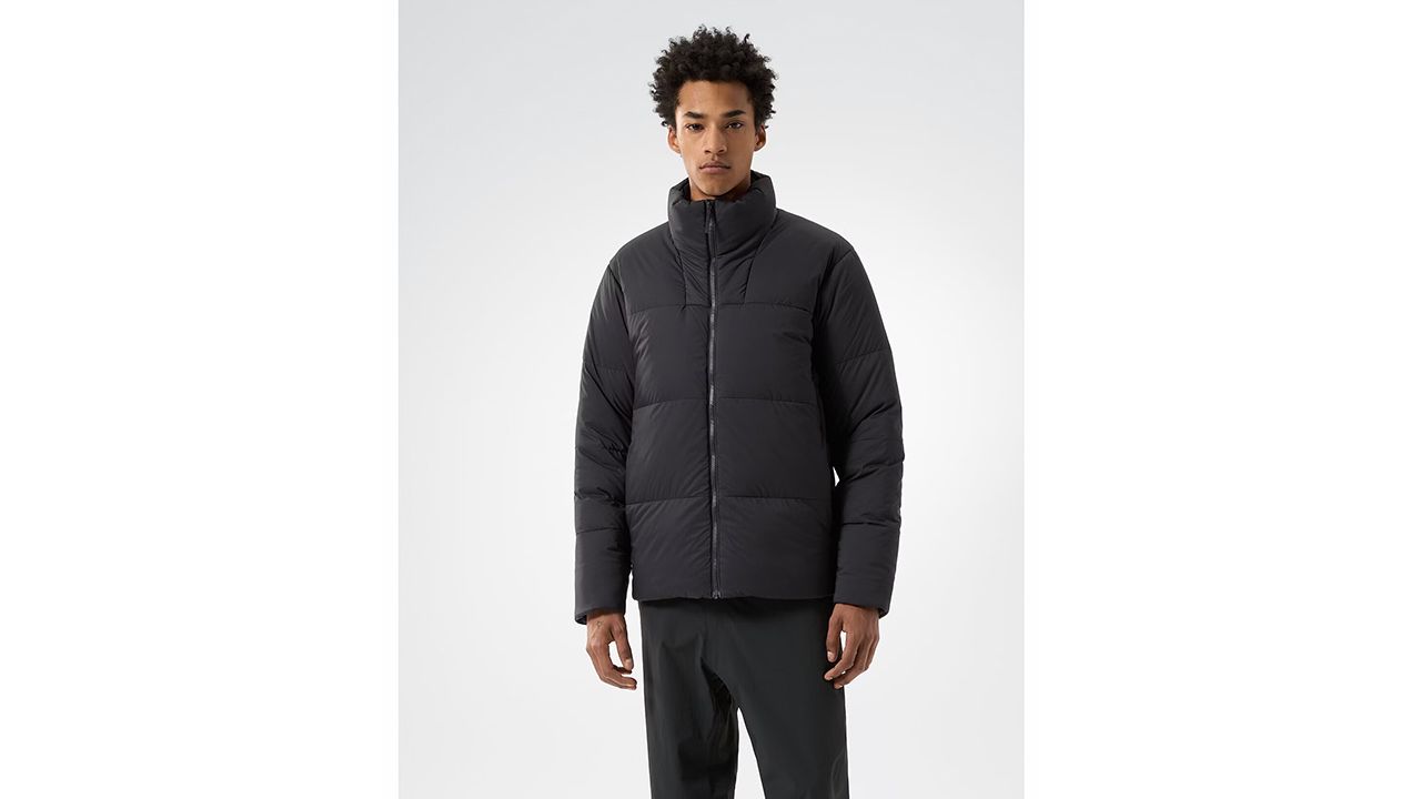 A photo of a person wearing a black Arc’teryx Men’s Conduit Down Jacket