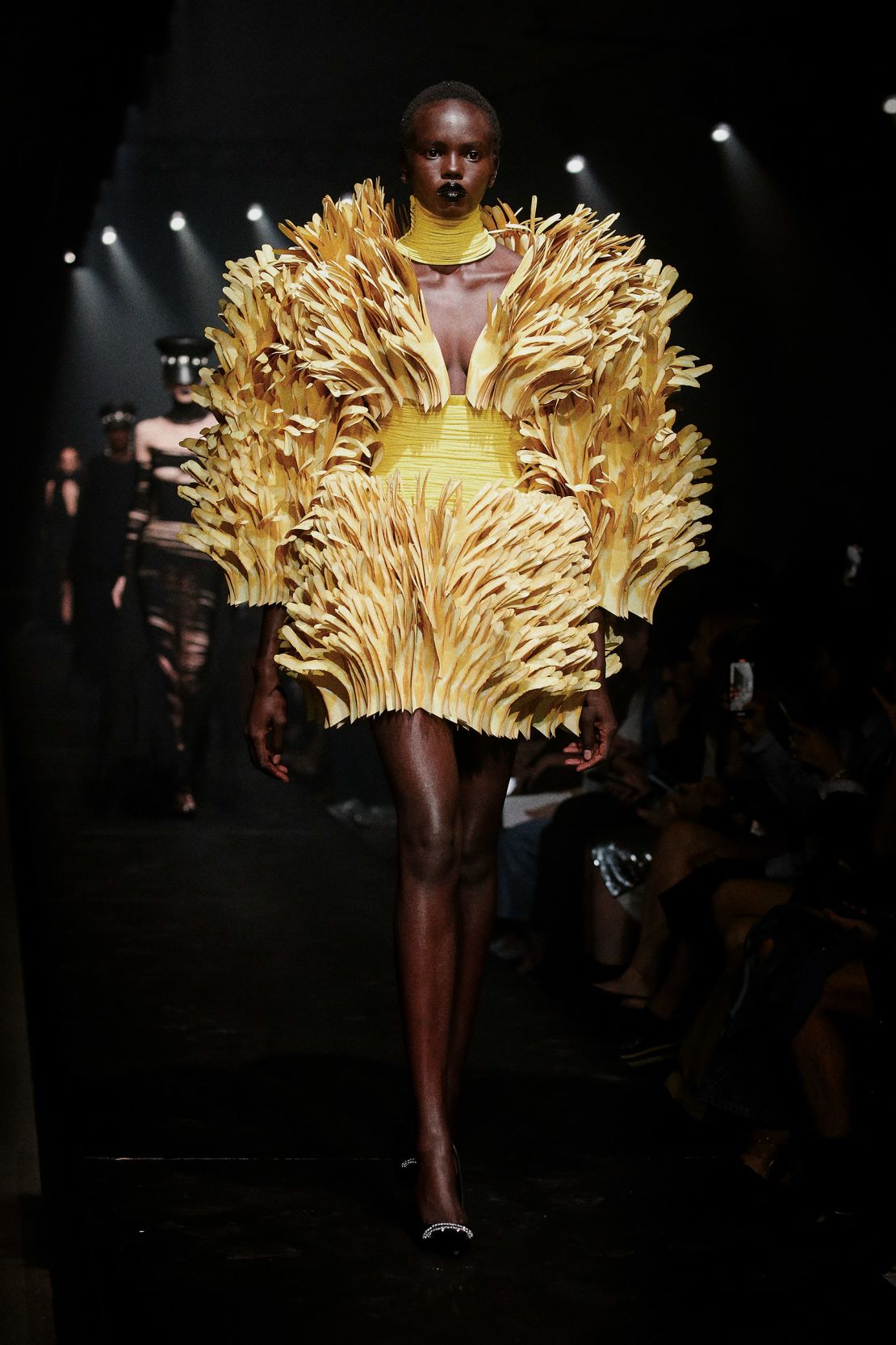 This look, too, featured hands — with thousands of layered cutouts used to form a sculptural couture dress.