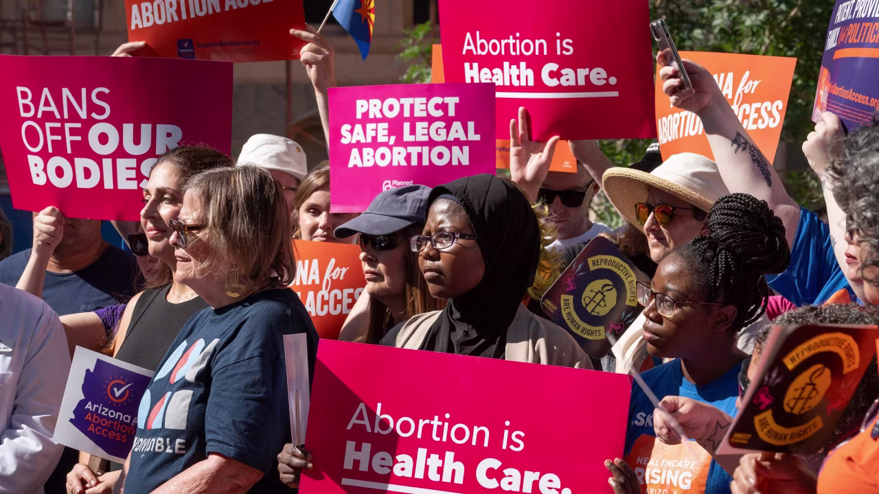 Supporters listen during an Arizona for Abortion Access news conference on July 3, 2024, at the Arizona State Capitol.