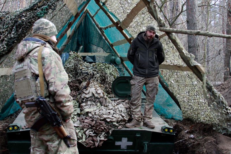 Gunner Artem âSailorâ stands on the Gvozdika artillery piece at a rare position in eastern Ukraine.