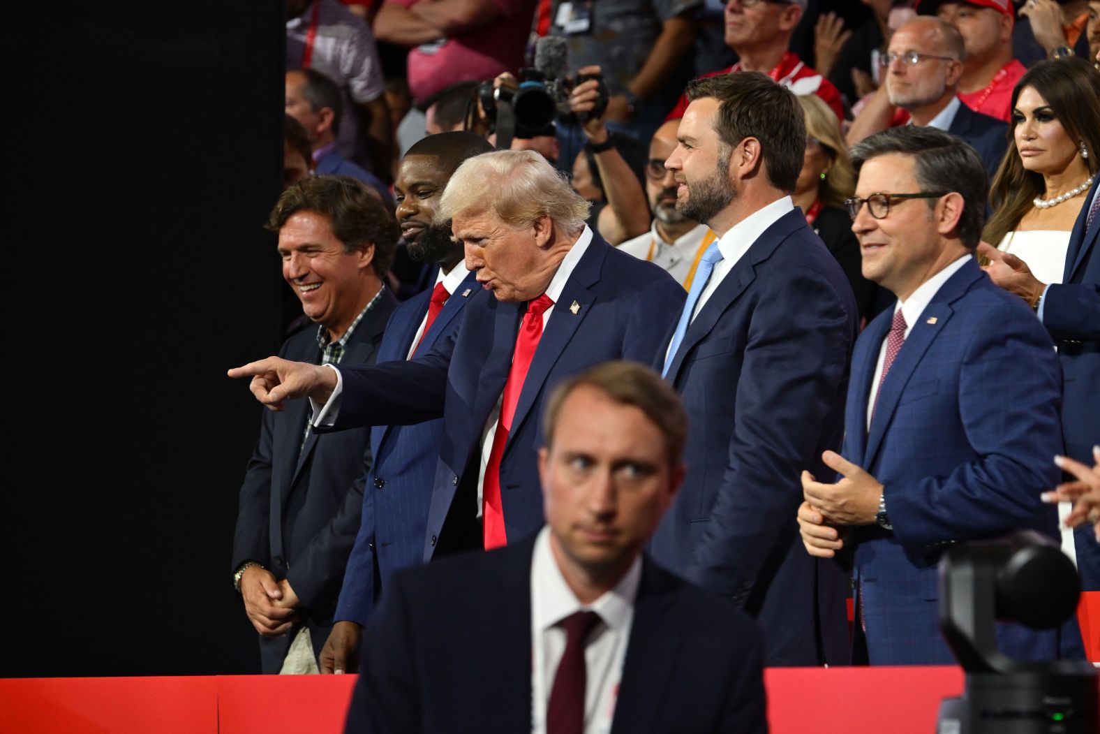 Trump points to the crowd at the Fiserv Forum on Monday.