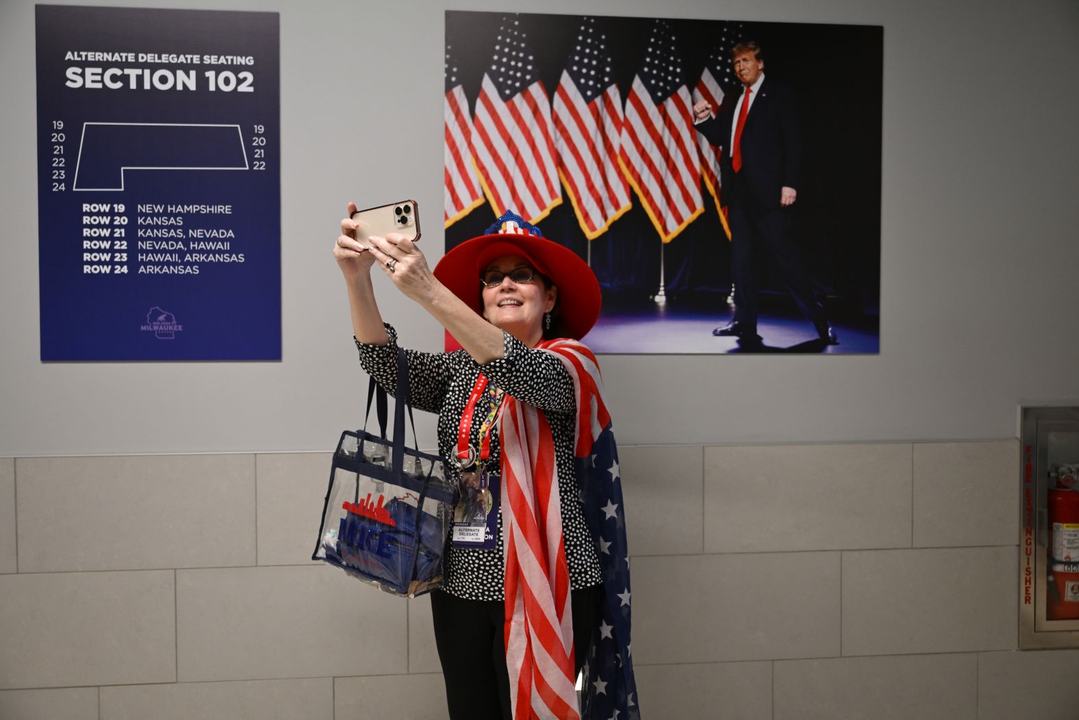 An alternate delegate takes a selfie at the Fiserv Forum on Monday.