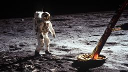 Astronaut Edwin E. Aldrin Jr., lunar module pilot, walks on the surface of the moon near a leg of the Lunar Module during the Apollo 11 extravehicular activity (EVA). Astronaut Neil A. Armstrong, Apollo 11 commander, took this photograph with a 70mm lunar surface camera. The astronauts' bootprints are clearly visible in the foreground. While astronauts Armstrong and Aldrin descended in the Lunar Module (LM) "Eagle" to explore the Sea of Tranquility region of the moon, astronaut Michael Collins, command module pilot, remained with the Command and Service Modules (CSM) "Columbia" in lunar orbit.