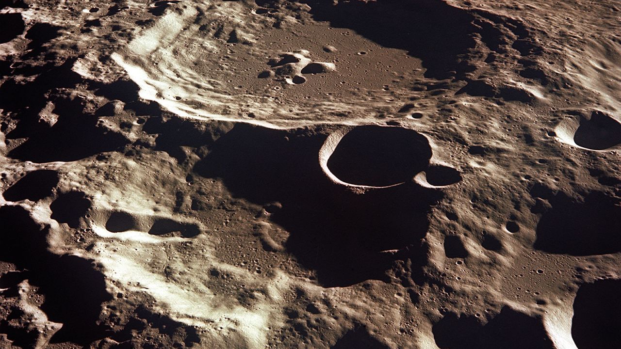 An oblique of the Crater Daedalus on the lunar farside as seen from the Apollo 11 spacecraft in lunar orbit. The view looks southwest. Daedalus (formerly referred to as I.A.U. Crater No. 308) is located at 179 degrees east longitude and 5.5 degrees south latitude. Daedalus has a diameter of about 50 statute miles.
