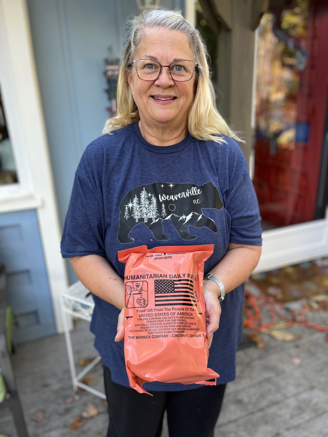 Diane Anna of Weaverville, North Carolina, holds food rations delivered by the Federal Emergency Management Agency.