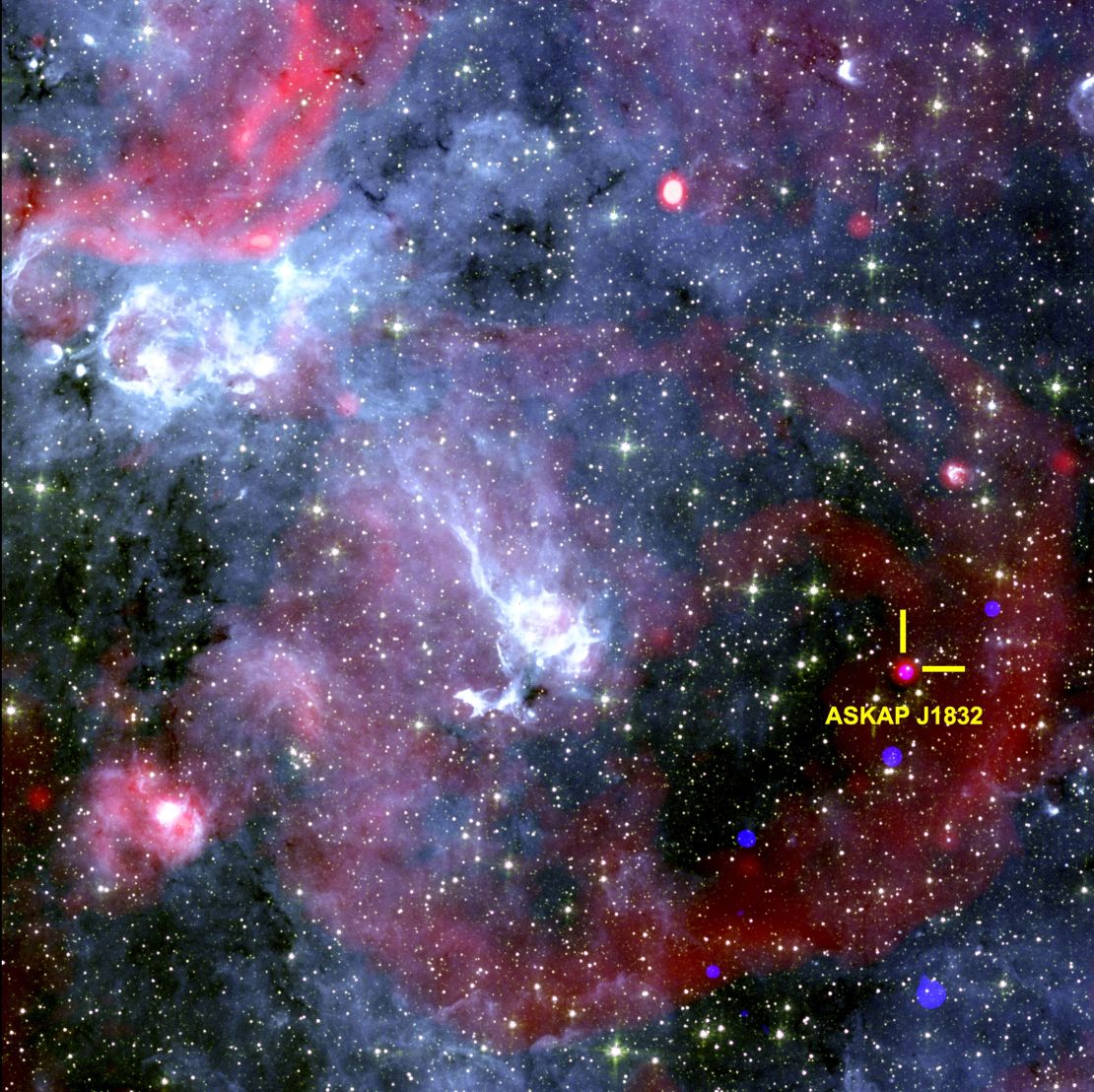 The blank image shows the area around ASKAP J1832-0911. It combines x-rays from NASA's Chandra X-ray Observatory, wireless data from the South African Meerkat wireless telescope, and infrared data from NASA's Spitzer Space Telescope.