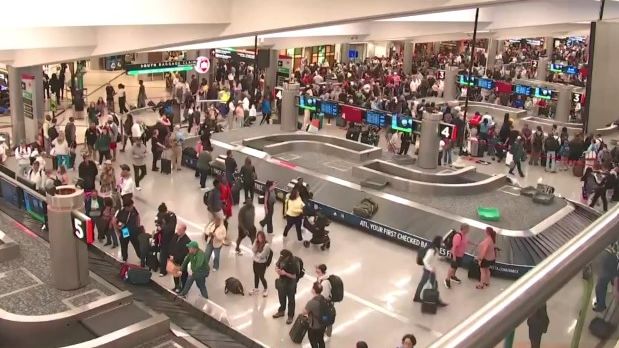 Mounting TSA lines forced travelers to queue all the way back to the baggage claim area in Atlanta.