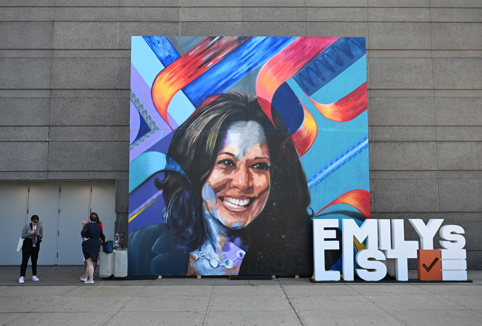 A portrait of Harris sits outside the United Center on Monday.