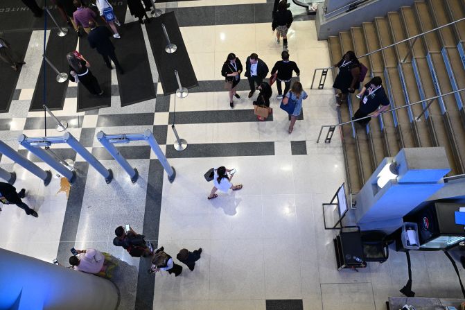 Convention attendees walk inside the United Center on Monday.