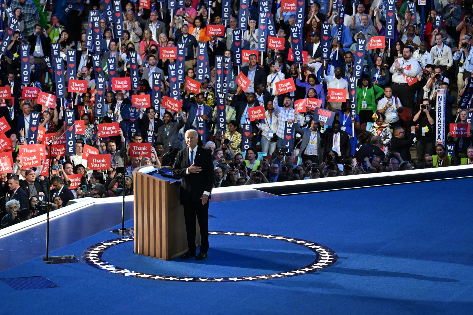 Biden was greeted by <a href="https://www.cnn.com/politics/live-news/dnc-democratic-national-convention-08-19-24#h_b9a63db57ea07230b9de41e51358101a">more than four minutes of applause</a> when he first took the stage Monday. People in the crowd held signs that said, "Thank you Joe." They also chanted the phrase.