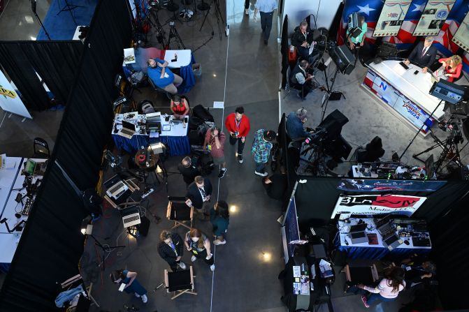 Media members work at the convention site on Wednesday.