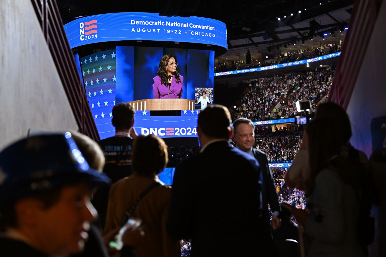 Winfrey is seen on a video screen inside the United Center. “Values and character matter most of all — in leadership and in life,” <a href="https://www.cnn.com/politics/live-news/dnc-democratic-national-convention-08-21-24#h_ce259c7b903419f0426ca30f42cac7a0">Winfrey said</a>. “Decency and respect are on the ballot in 2024. And just plain common sense tells you that Kamala Harris and Tim Walz can give us decency and respect.”