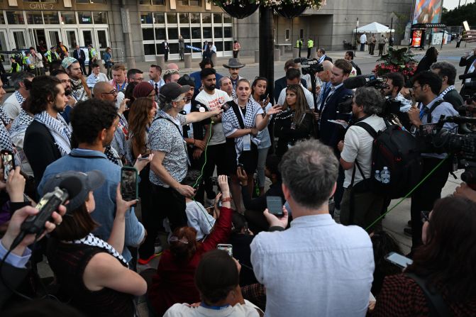 Pro-Palestinian protesters speak outside the United Center on Thursday. Leaders of the?<a >Uncommitted National Movement</a>?were holding a sit-in outside the convention after being told on Wednesday night that its allies would not be allowed to address the United Center from the stage.