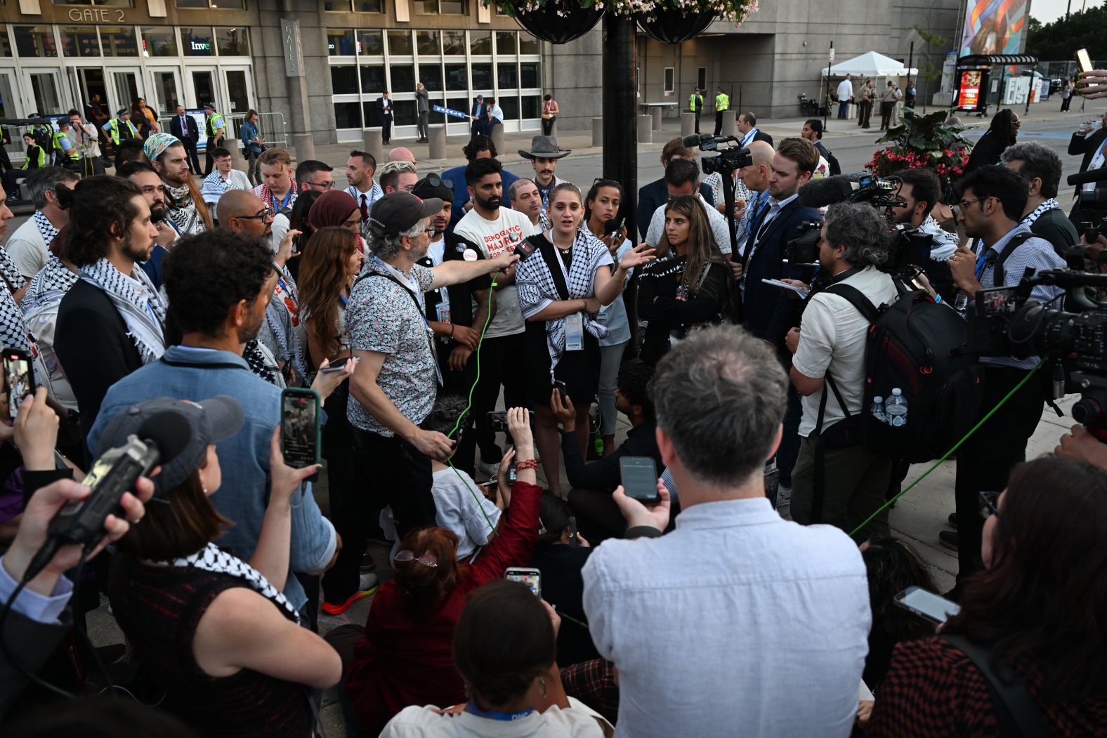 Pro-Palestinian protesters speak outside the United Center on Thursday. Leaders of the?<a >Uncommitted National Movement</a>?were holding a sit-in outside the convention after being told on Wednesday night that its allies would not be allowed to address the United Center from the stage.