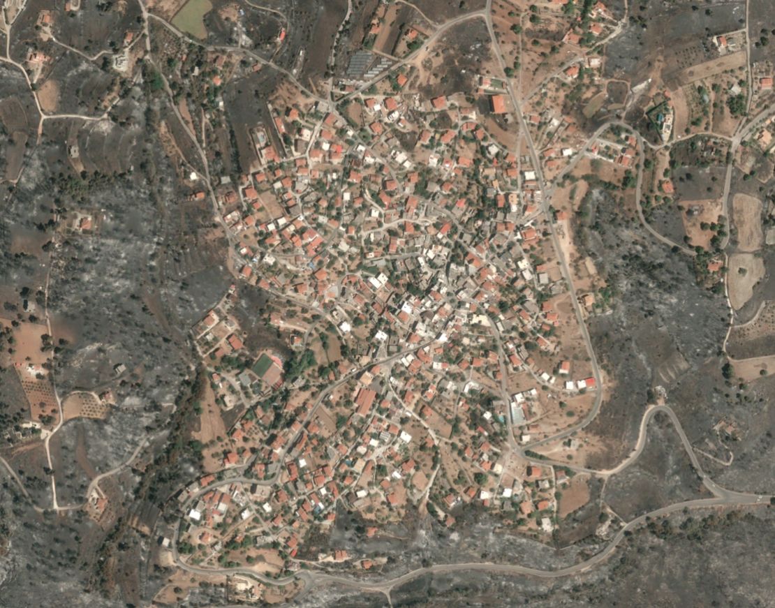 Varnavas, a town near where the wildfires started, is ringed by scorched land.