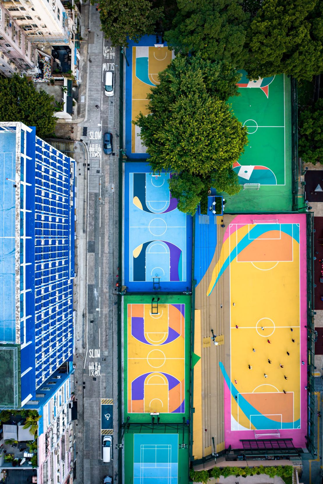 Five colorful basketball courts in Sheung Wan, near Blue Lotus Gallery where Bell is exhibiting his collection.