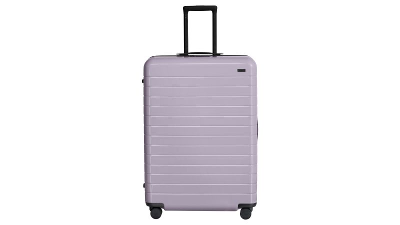 Away s gloss suitcases now come in Orchid and Navy colors CNN