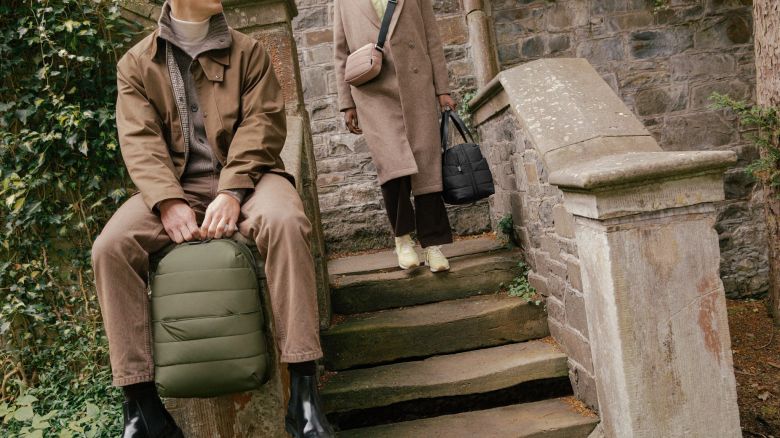 A photo of two people using new bags in the Away Quilted Collection