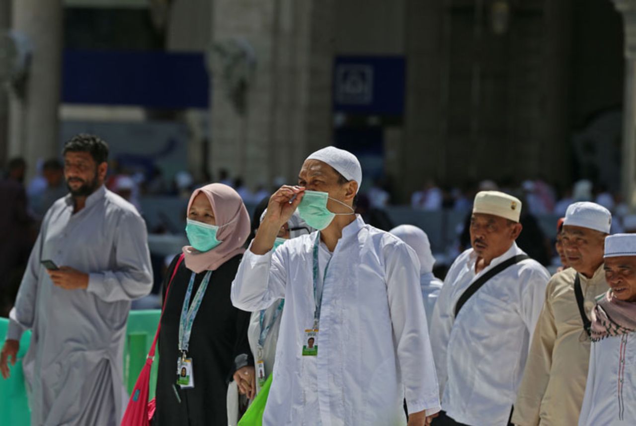 Muslim pilgrims wear masks at the Grand Mosque in Saudi Arabia's holy city of Mecca on February 27.