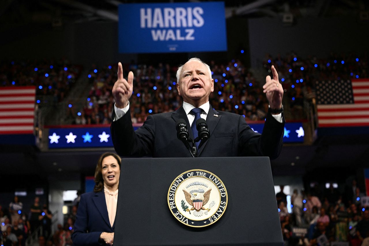 Democratic vice presidential candidate Minnesota Gorvernor Tim Walz speaks as Vice President and 2024 Democratic presidential candidate Kamala Harris looks on, in Philadelphia, Pennsylvanian  Tuesday, August 6.