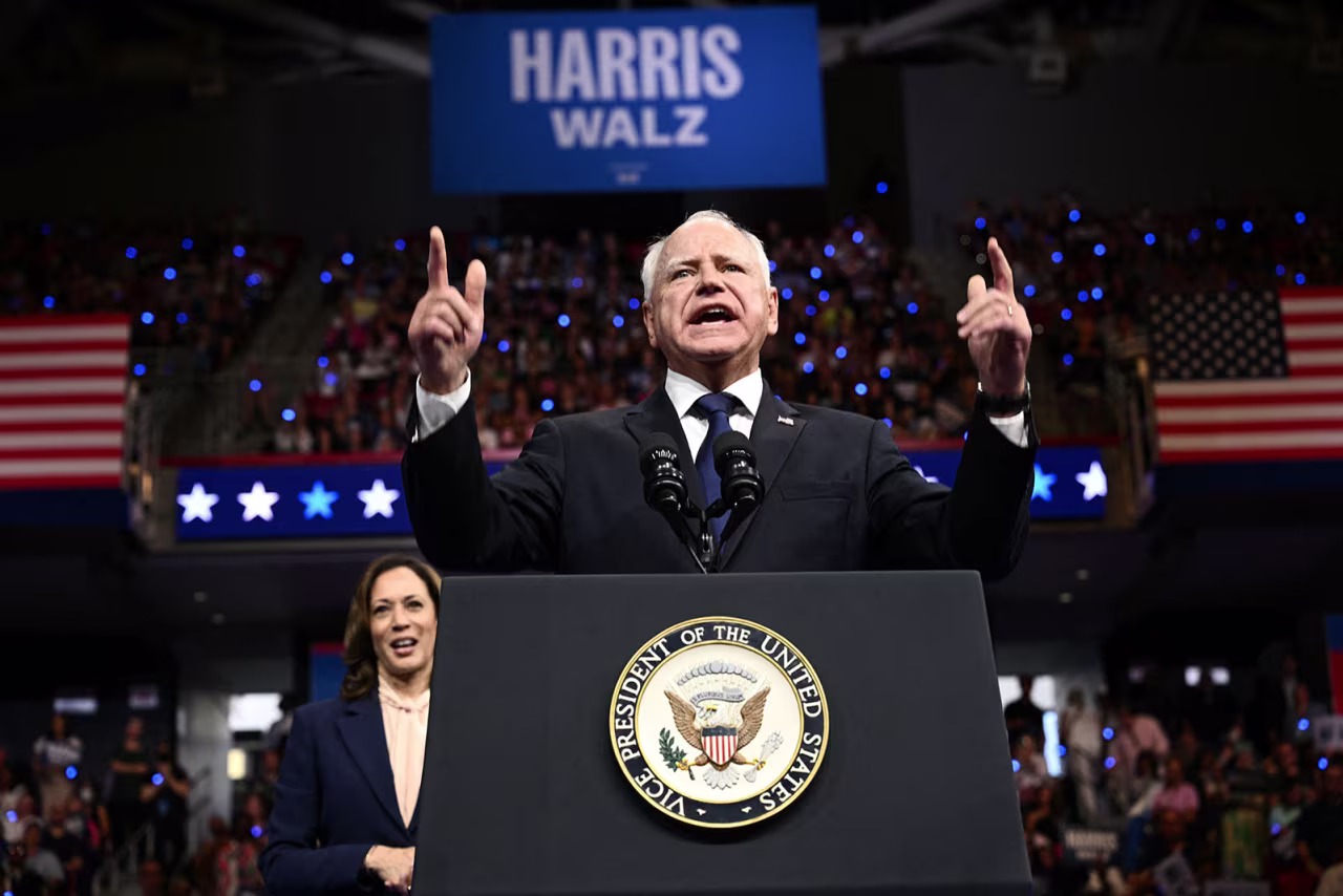 Democratic vice presidential candidate Minnesota Gorvernor Tim Walz speaks as Vice President and 2024 Democratic presidential candidate Kamala Harris looks on, in Philadelphia, Pennsylvanian  Tuesday, August 6.
