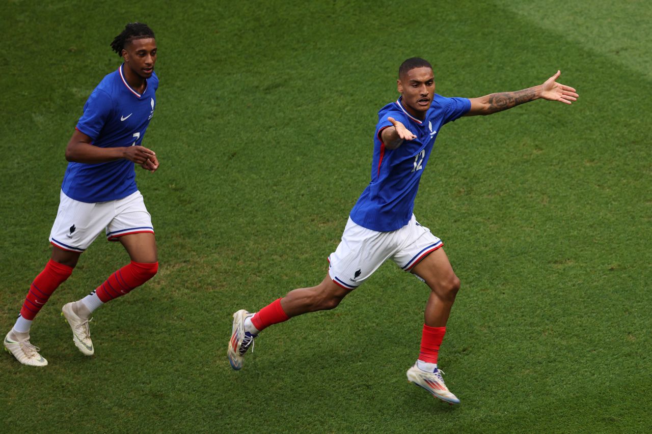 France’s Enzo Millot, right, celebrates scoring his team's first goal against Spain on August 9. 