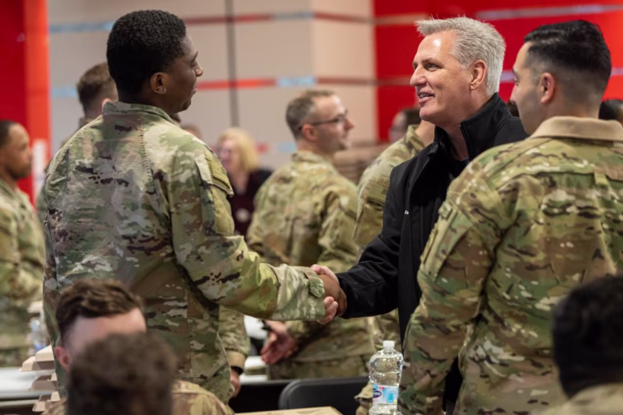 McCarthy meets with troops in Poland, in this handout photo released on April 10. 