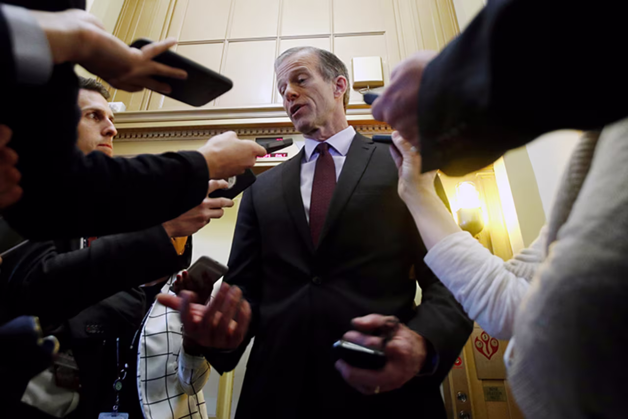 Sen. John Thune talks with  reporters outside his office on Wednesday, January 29.