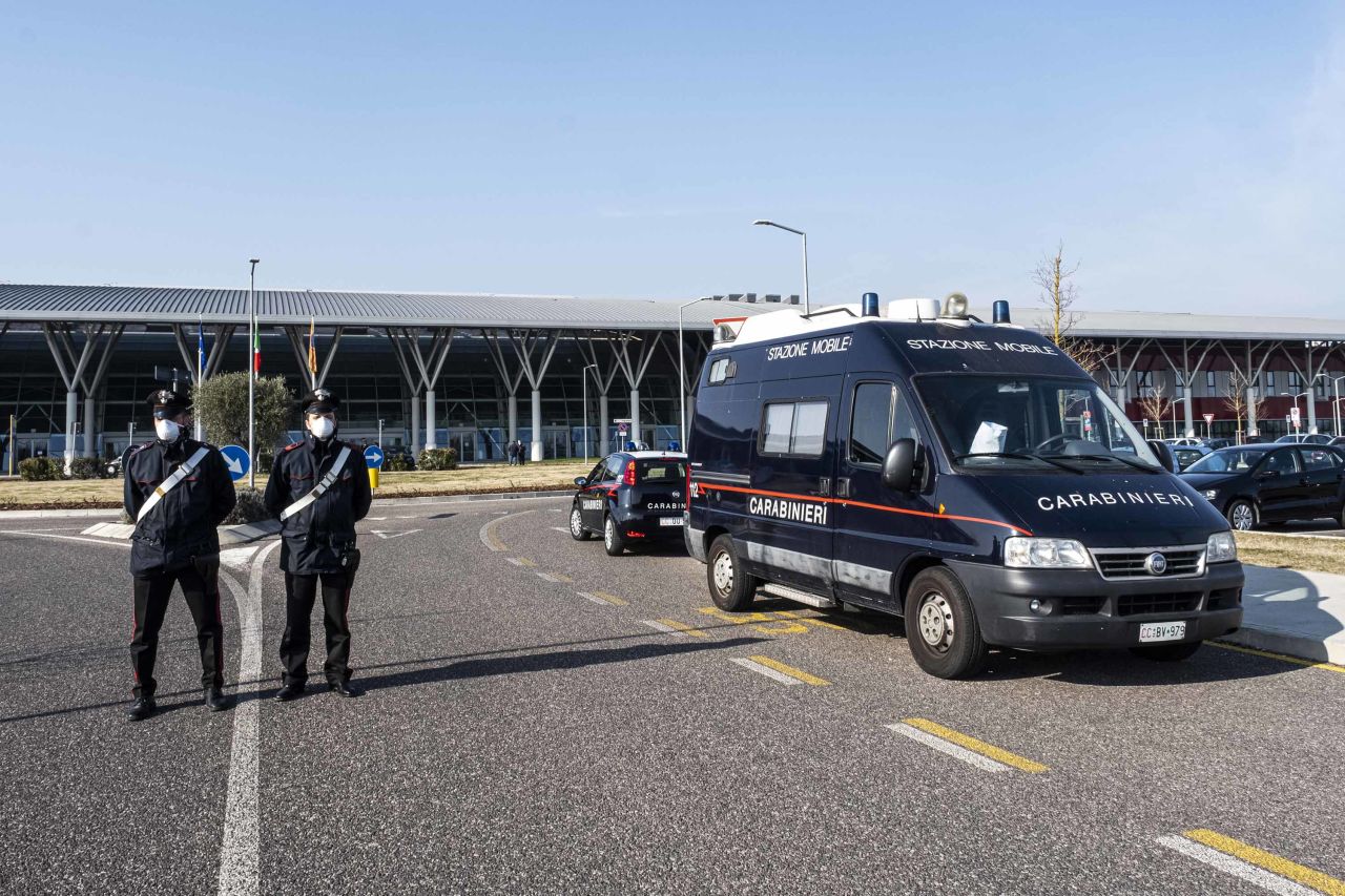 Italian officials are seen outside a hospital where coronavirus patients are isolated in quarantine in Schiavonia, Italy on February 22.