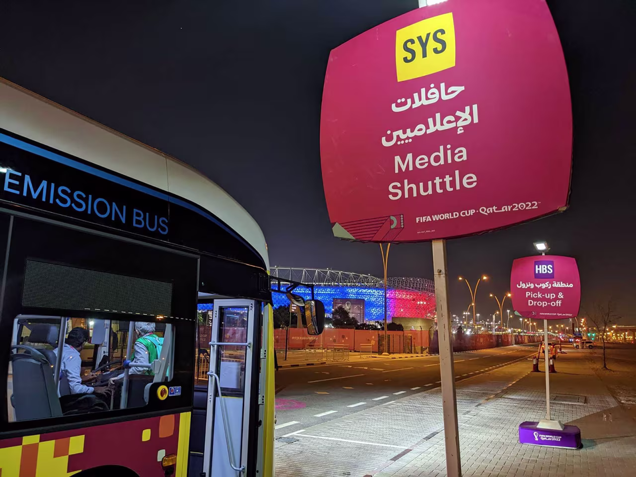 A media shuttle bus stop for journalists is seen outside of a 2022 World Cup venue.