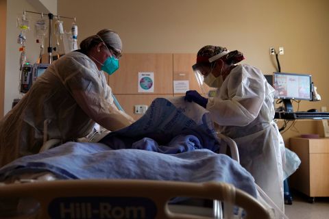 Registered nurses treat a Covid-19 patient at Providence Holy Cross Medical Center on December 22, 2020 in Los Angeles, California.