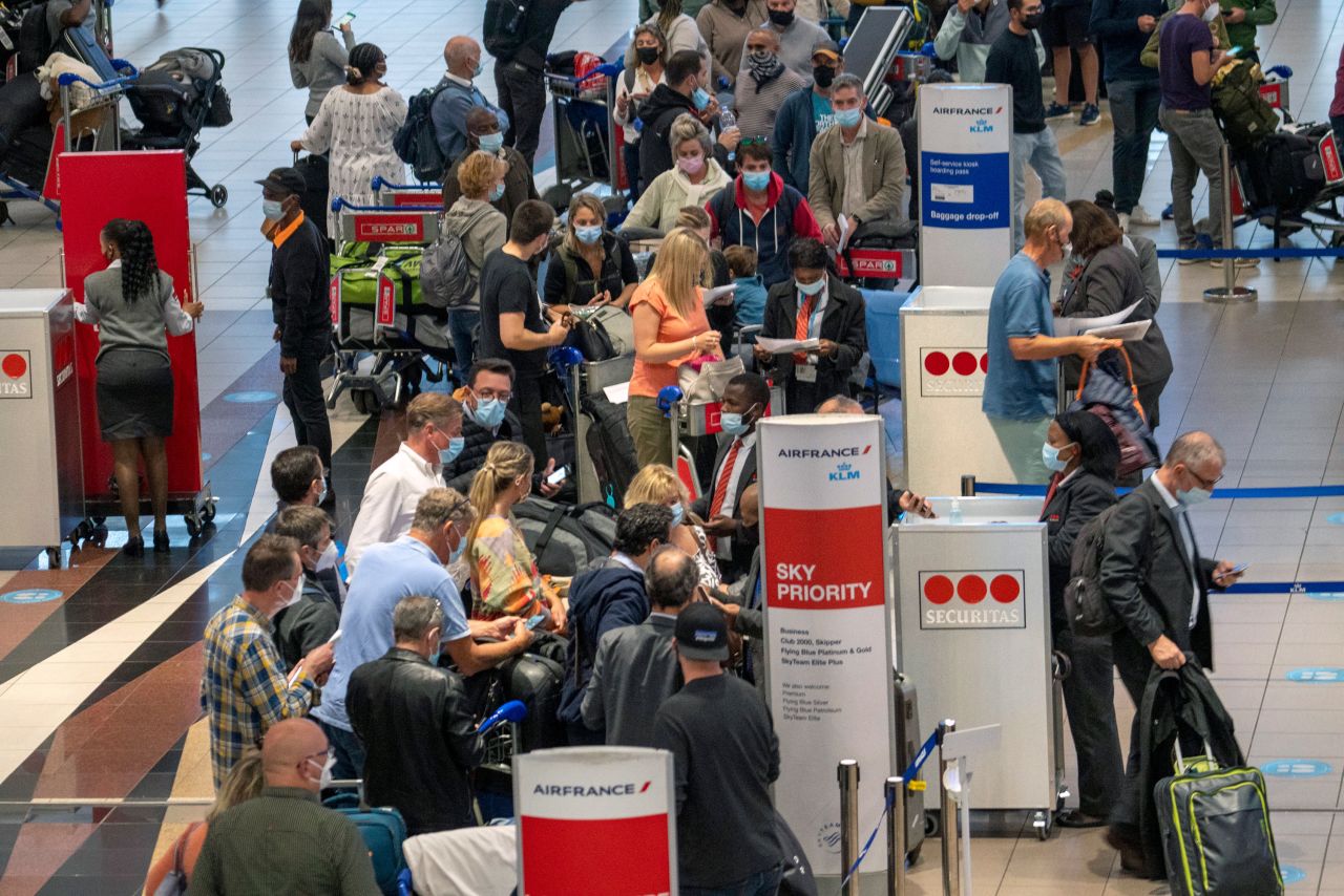 People line up for a flight at OR Tambo International Airport in Johannesburg, South Africa, on November 26.