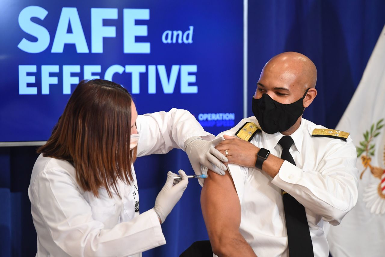 US Surgeon General Jerome Adams receives the COVID-19 vaccine in the Eisenhower Executive Office Building in Washington, DC, on Friday, December 18.