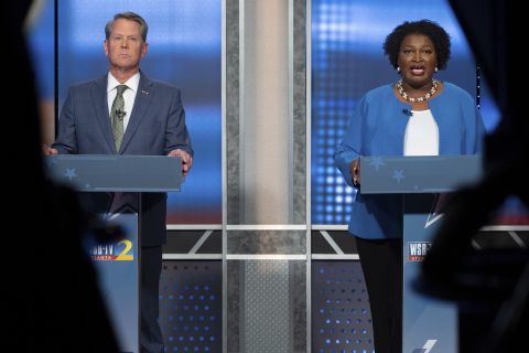 Republican Georgia Gov. Brian Kemp, left, and Democratic challenger Stacey Abrams face off during their debate, in Atlanta, Sunday.