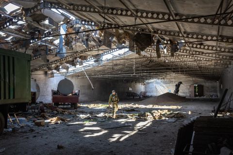 A Ukrainian army officer inspects a grain warehouse earlier shelled by Russian forces on May 6 in Novovorontsovka, Ukraine. (John Moore/Getty Images)