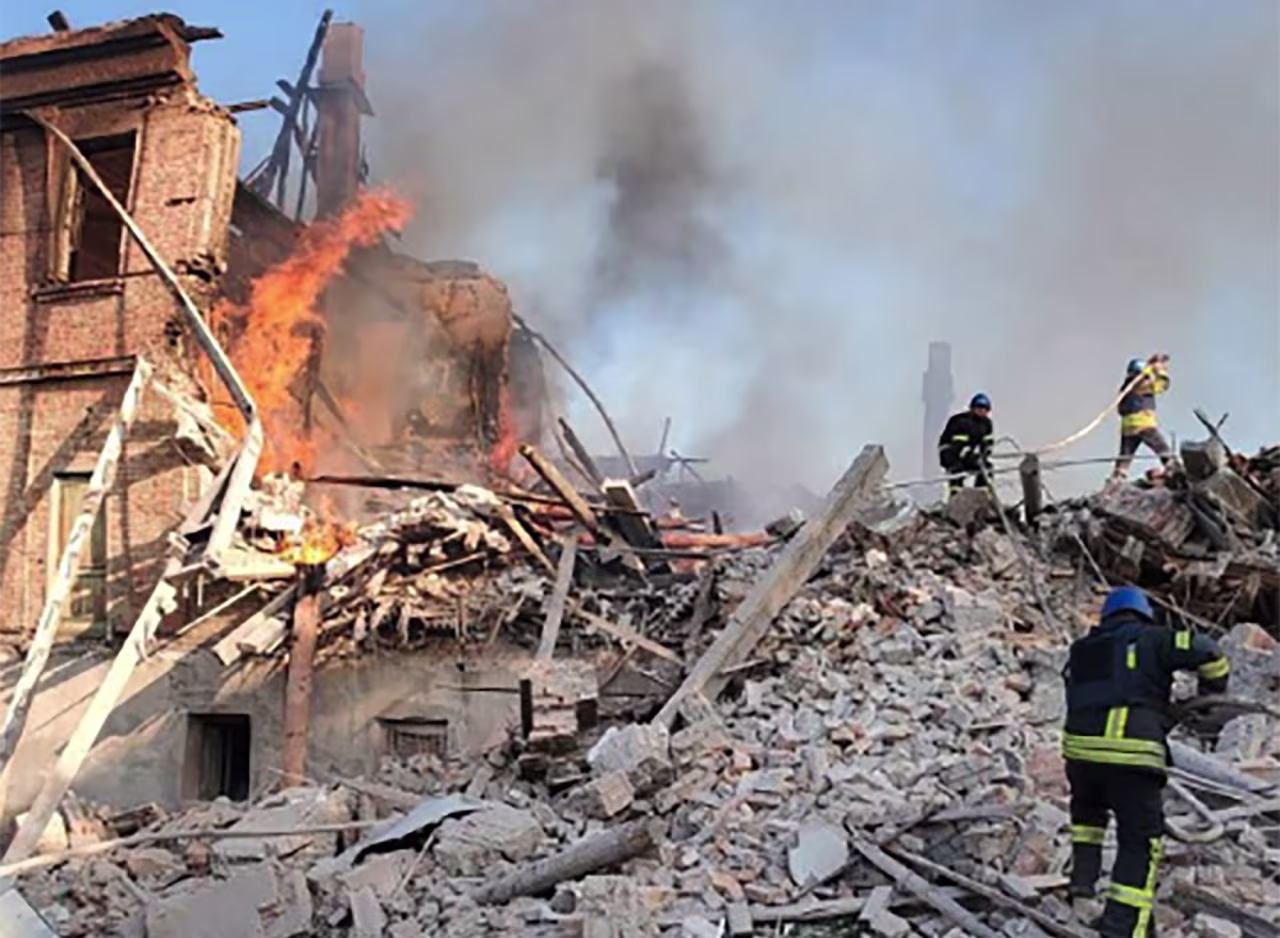 Emergency personel clear away debris after a bomb destroyed a school in the village of Bilohorivka, Ukraine on Saturday May 7. 