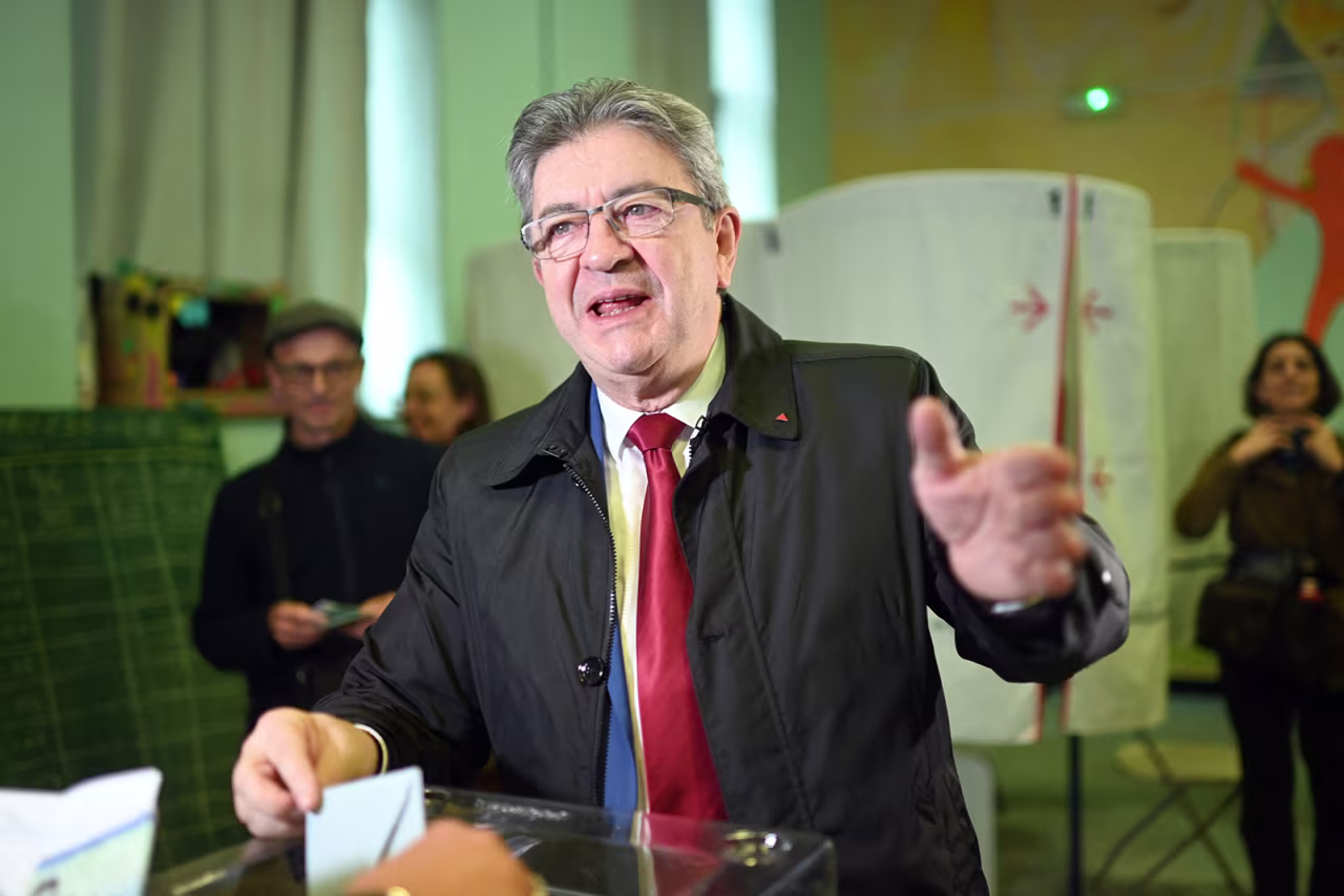 France's leftist movement La France Insoumise party leader and former candidate for the 2022 presidential election Jean-Luc Melenchon casts his vote during the second round of France's presidential election at a polling station in Marseille, southern France, on April 24.