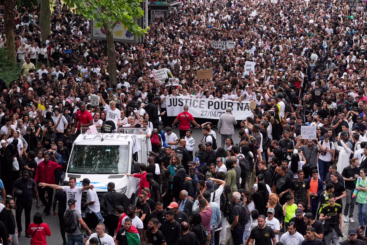A large crowd joins the mother of 17-year-old Nahel during a march on Thursday in Nanterre.