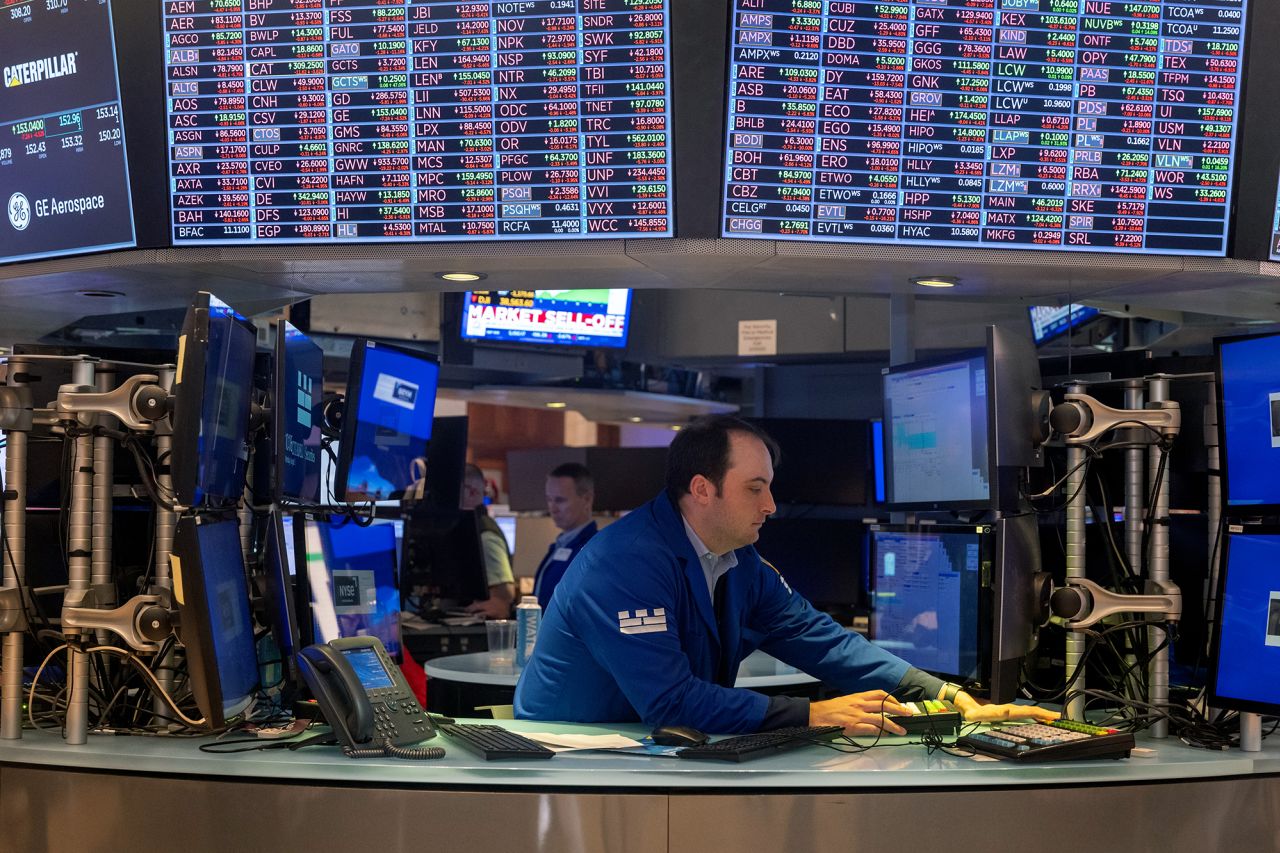 Traders work on the floor of the New York Stock Exchange on August 5.