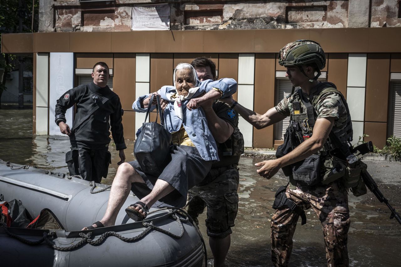 An elderly woman is evacuated from a flooded area in Kherson, Ukraine, on June 7. 