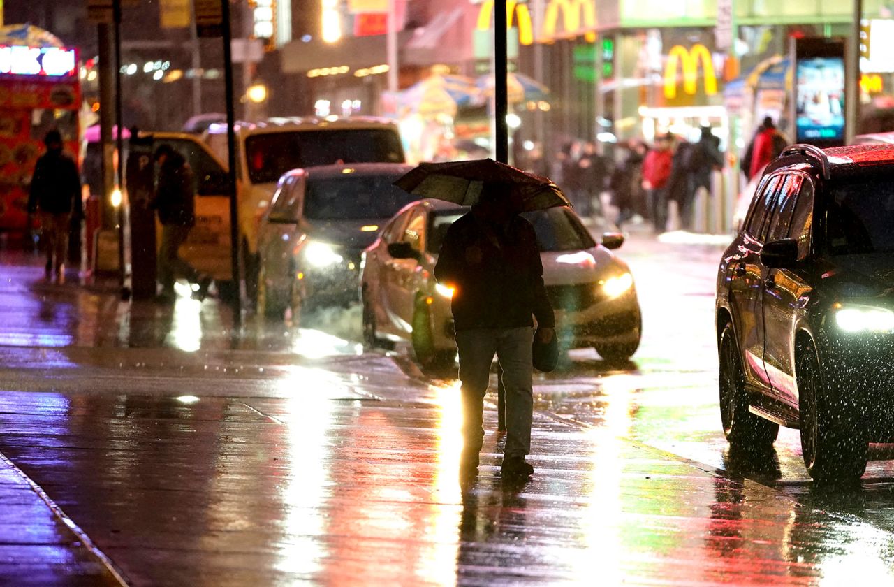 People walk through Times Square in New York on Tuesday.