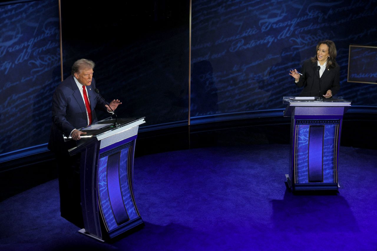 Republican presidential nominee, former U.S. President Donald Trump and Democratic presidential nominee, U.S. Vice President Kamala Harris both speak as they attend a presidential debate hosted by ABC in Philadelphia, Pennsylvania, on September 10.