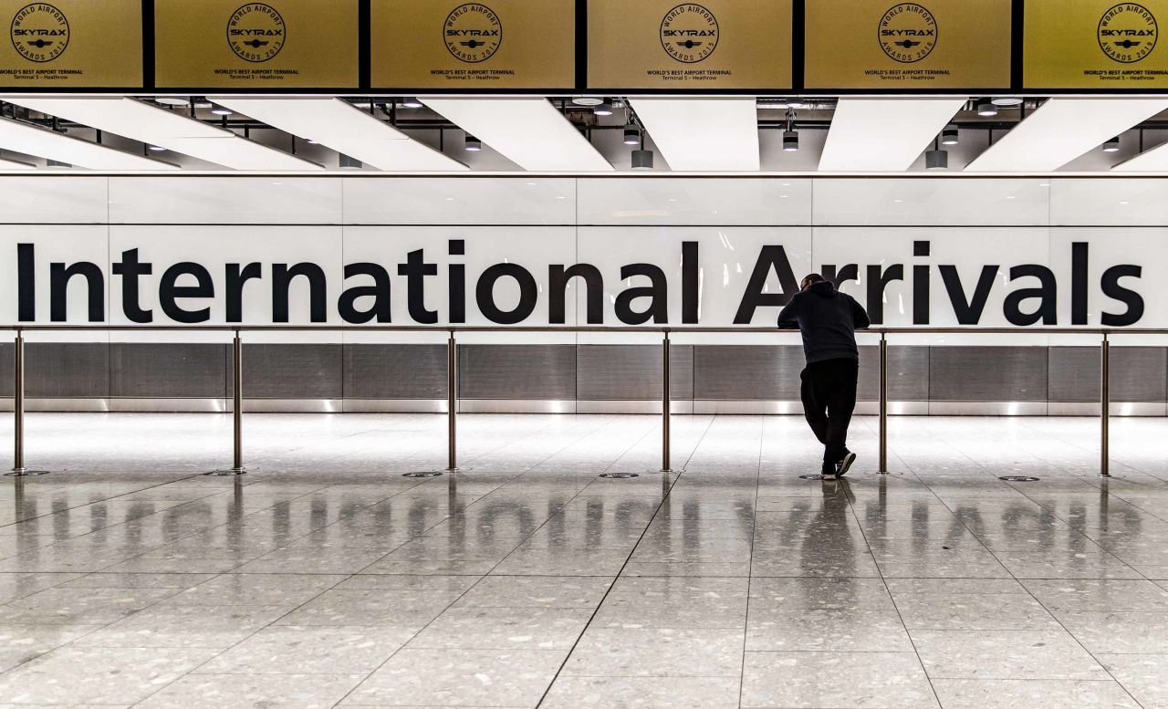 A person waits at the Heathrow Airport international arrival hall in London, on January 29.