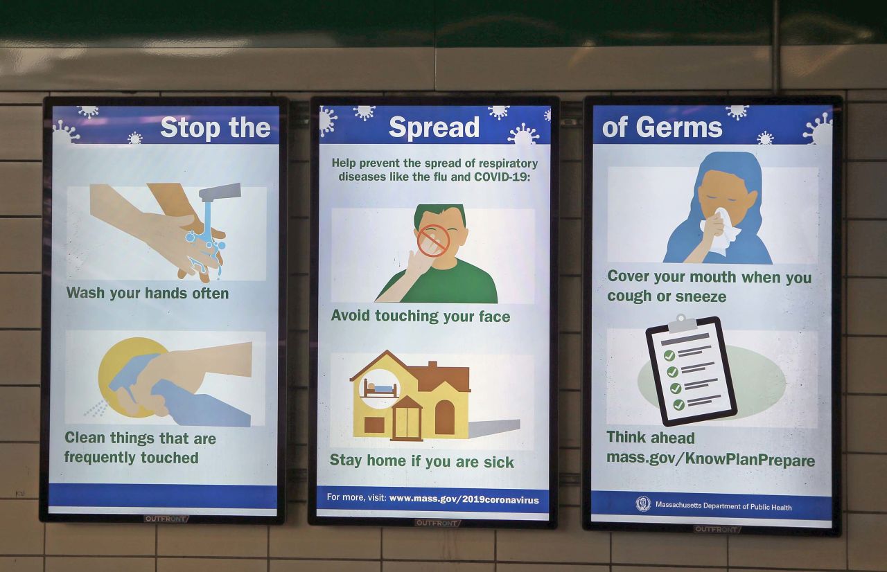 A sign listing ways to stop the spread of germs is seen in a subway station in Boston, on March 5.