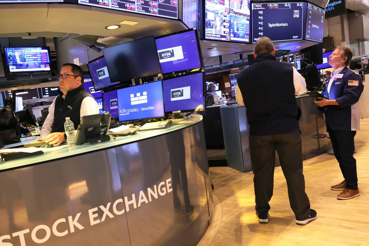 Traders work on the floor of the New York Stock Exchange during morning trading on April 10, in New York City.