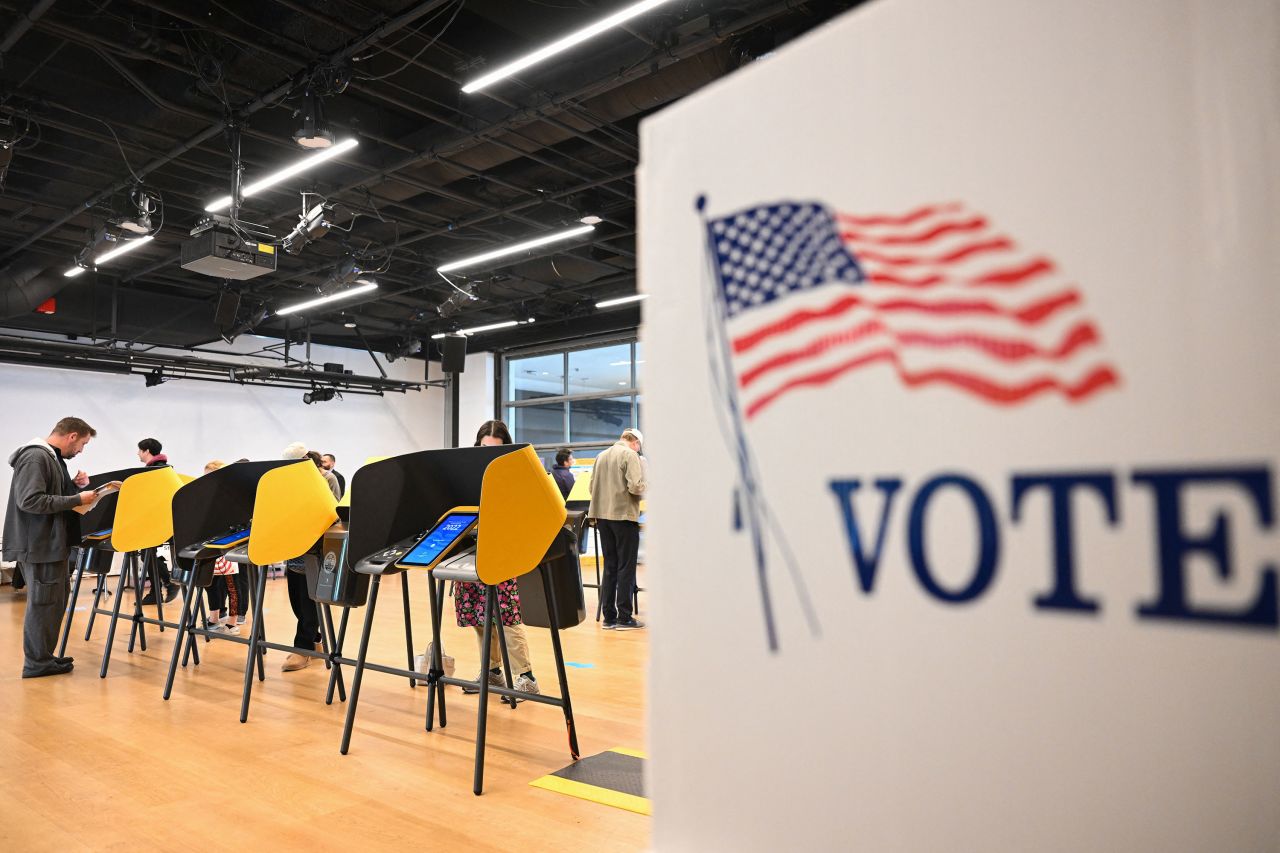 People cast ballots on electronic voting machines in Los Angeles in November 2022.