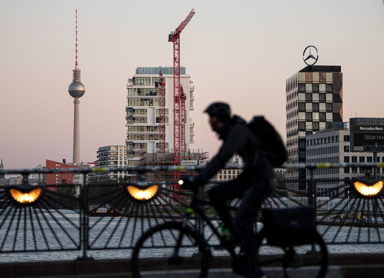 A cyclist crosses the Oberbaum Bridge in Berlin in the early morning of April 14. 