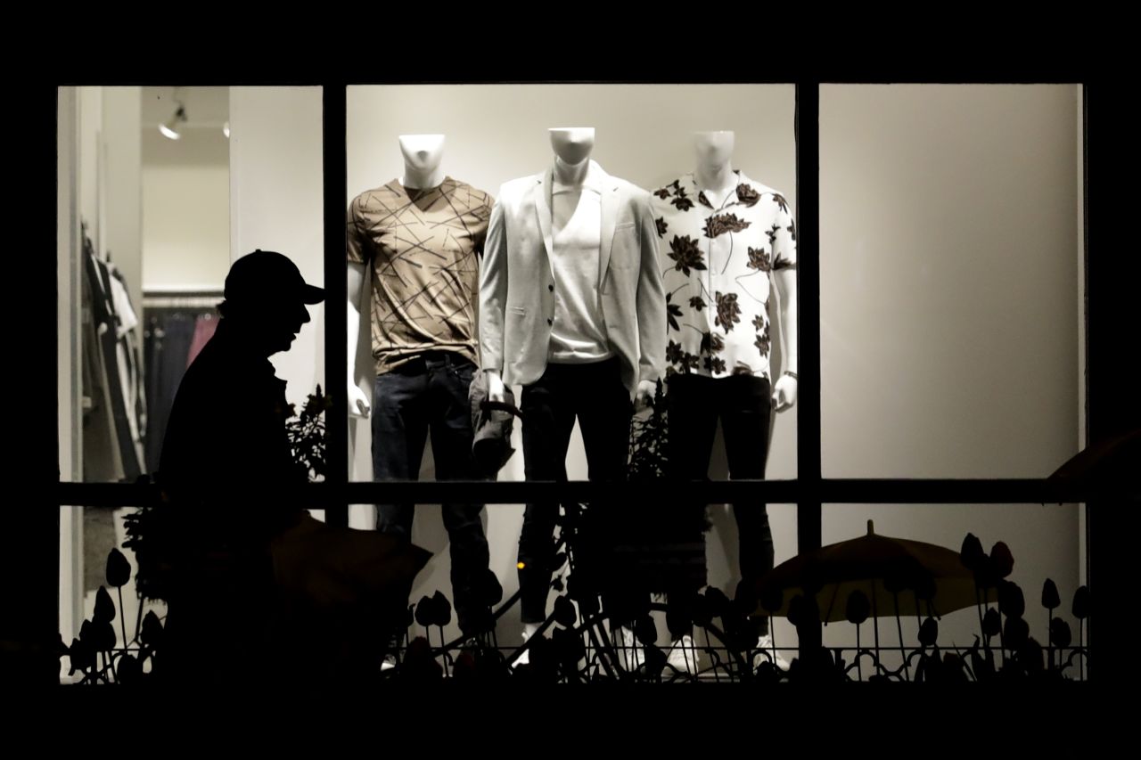 A man walks in front of an Express clothing store in Chicago on May 9.