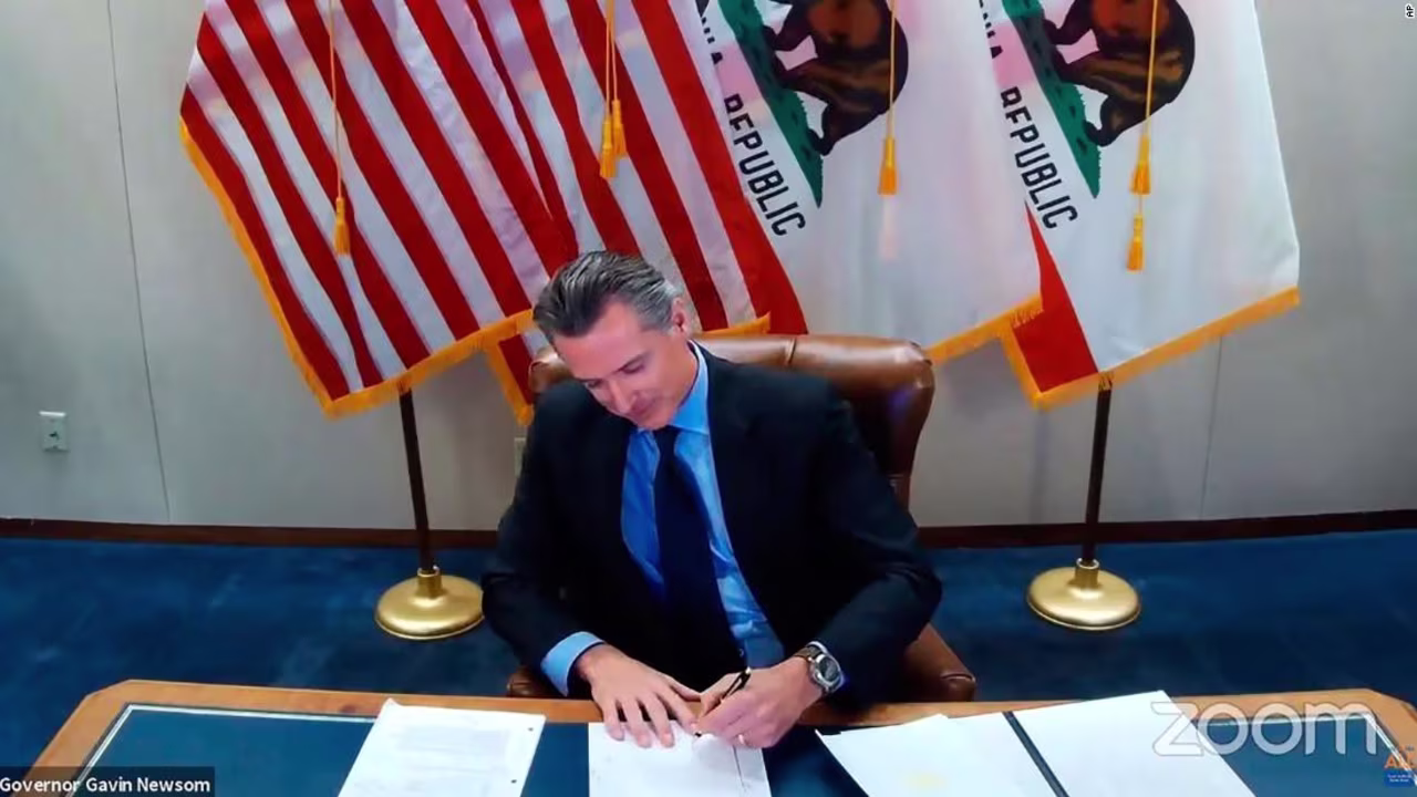 California Gov. Gavin Newsom signing a bill into law on Wednesday, Sept. 30, 2020, in Sacramento, Calif. 