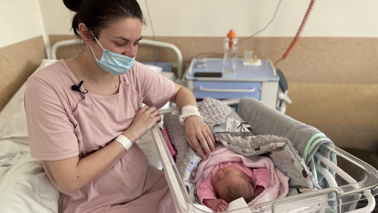 Khrystyna Pavluchenko tends to her newborn daughter, Adelina. 